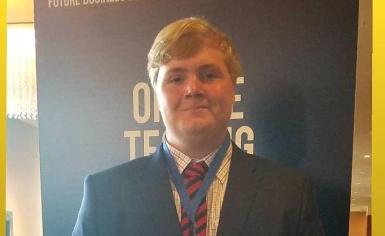 Luke Buettner stands proud at the National Leadership Conference for FBLA in San Antonio in July 2019.